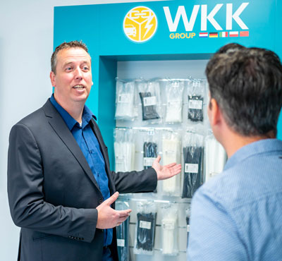 WKK employee talks to customer about cable ties