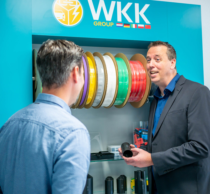 WKK employee talking with customer about Hongshang heat shrink tubing